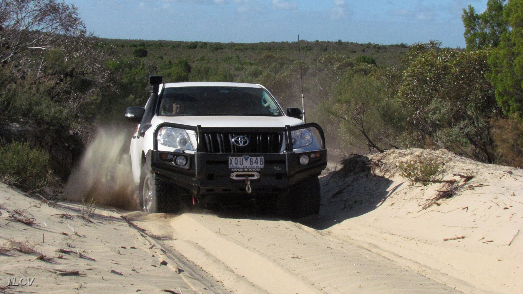 12-Coota spins the wheels up the dune.JPG